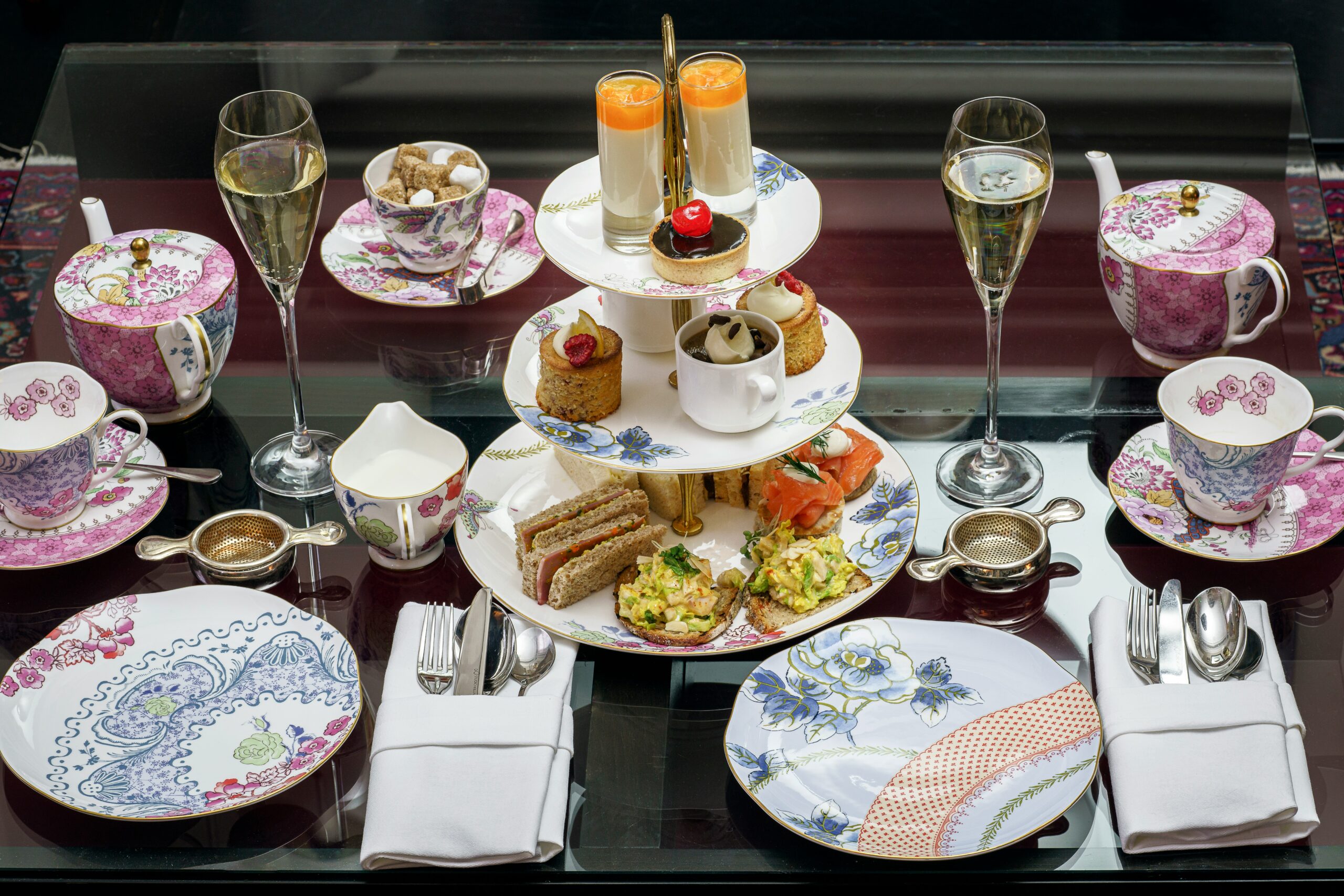 assorted pastries in rack between plates